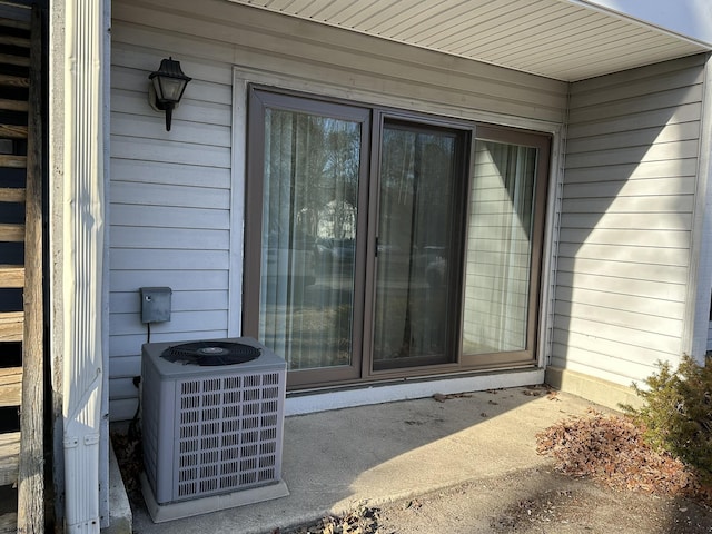 doorway to property with central air condition unit