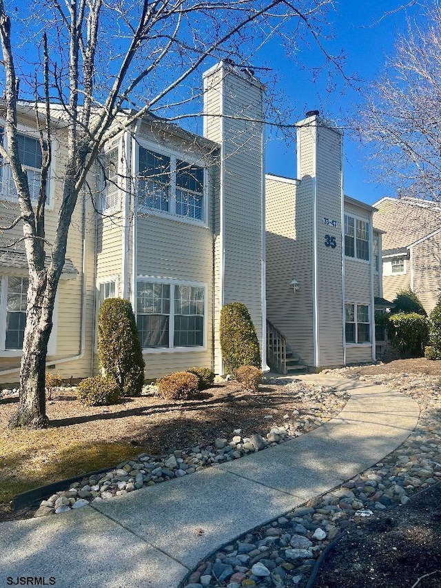 view of home's exterior with a chimney