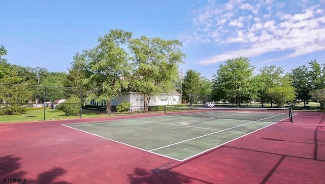 view of sport court with fence