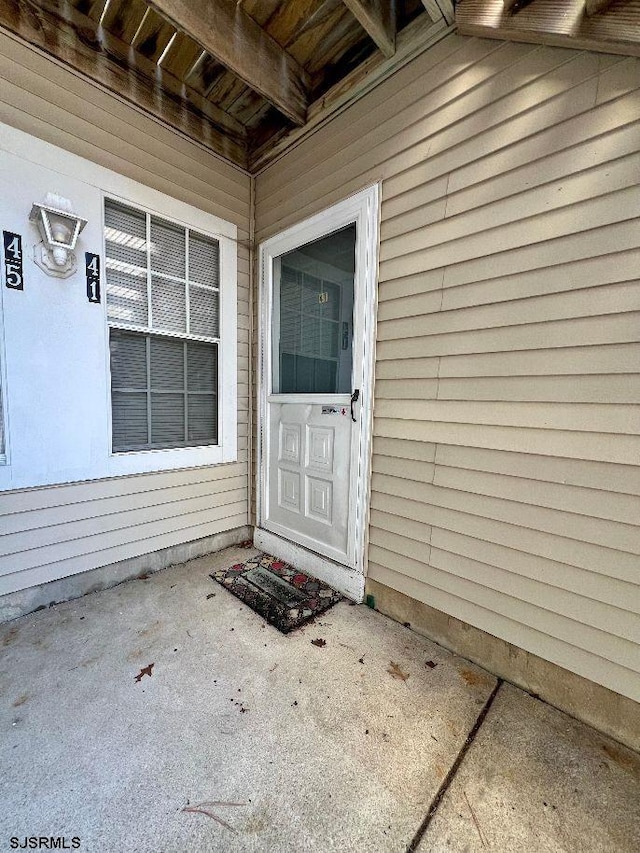 doorway to property featuring a patio area