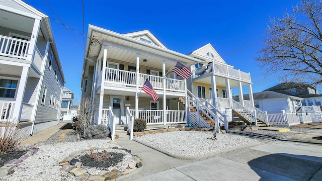 view of front of house with covered porch and a balcony