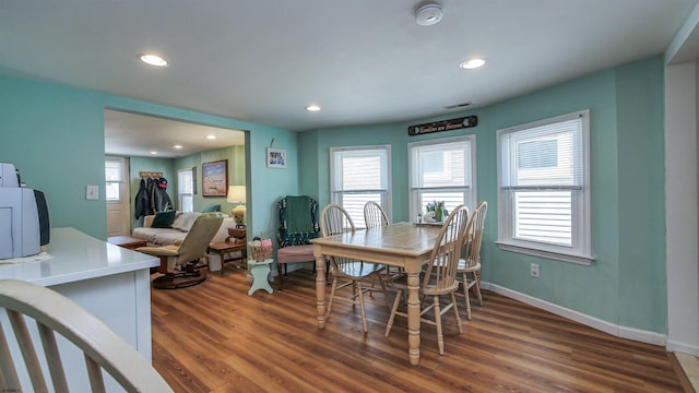 dining room with visible vents, baseboards, dark wood finished floors, and recessed lighting