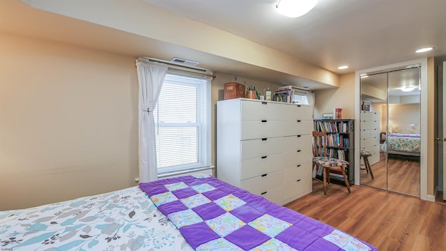 bedroom featuring recessed lighting and wood finished floors