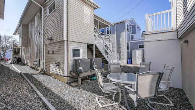 view of patio / terrace with outdoor dining space and stairway