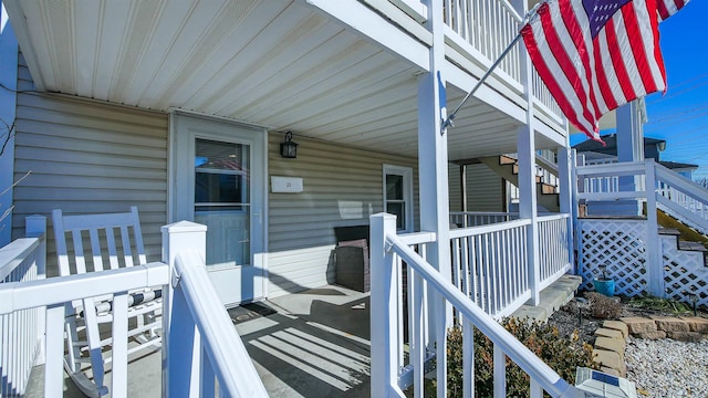 property entrance with covered porch