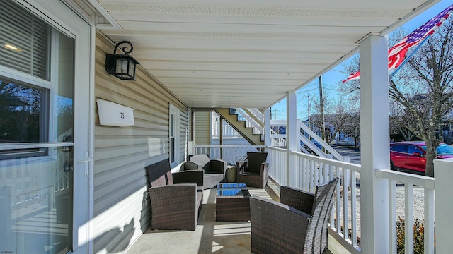 exterior space with stairs and an outdoor hangout area