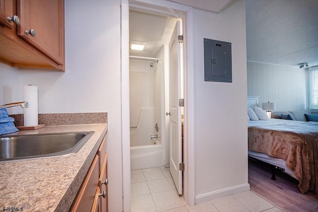 bathroom featuring ensuite bathroom, vanity, shower / bathing tub combination, electric panel, and tile patterned floors