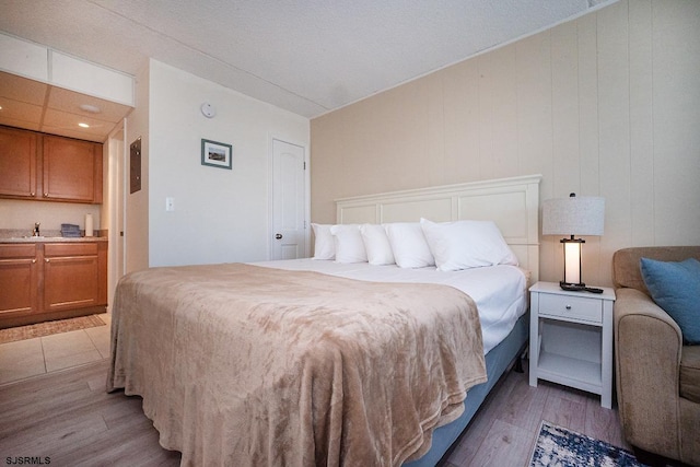 bedroom with light wood-style flooring