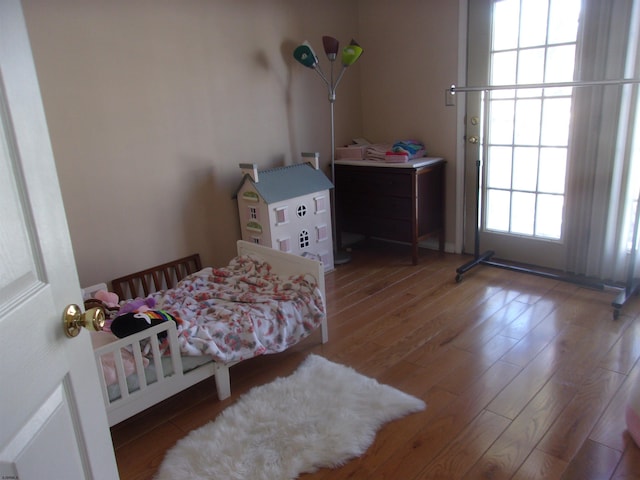 bedroom featuring wood finished floors