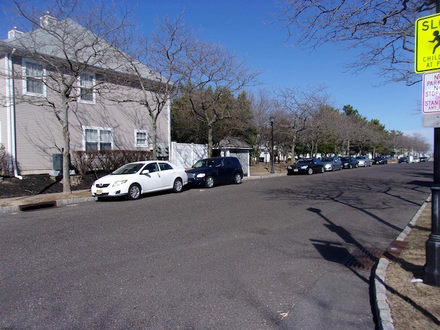 view of road featuring sidewalks and curbs