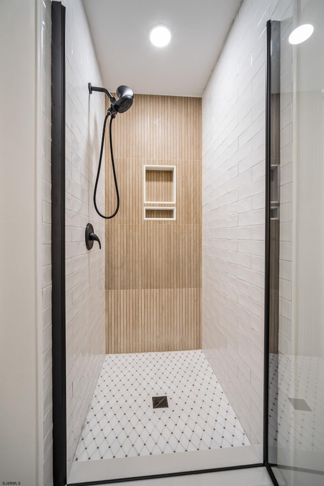 full bath with a shower stall