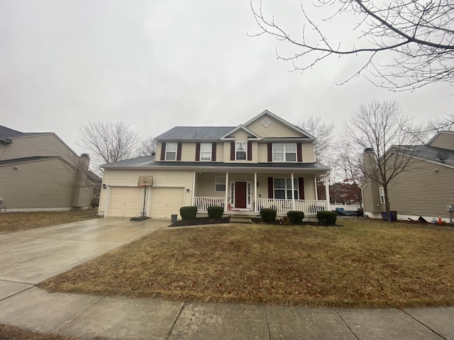 traditional home with covered porch, driveway, an attached garage, and a front yard