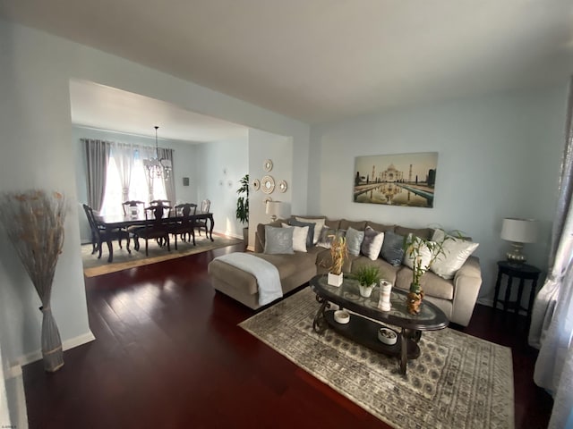 living room featuring dark wood-style floors and baseboards