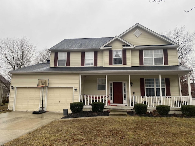 traditional-style house with a porch, a front yard, driveway, and an attached garage