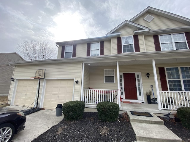 view of front of property with driveway, a porch, and an attached garage