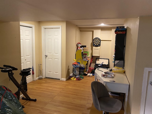 interior space with light wood-style floors and baseboards