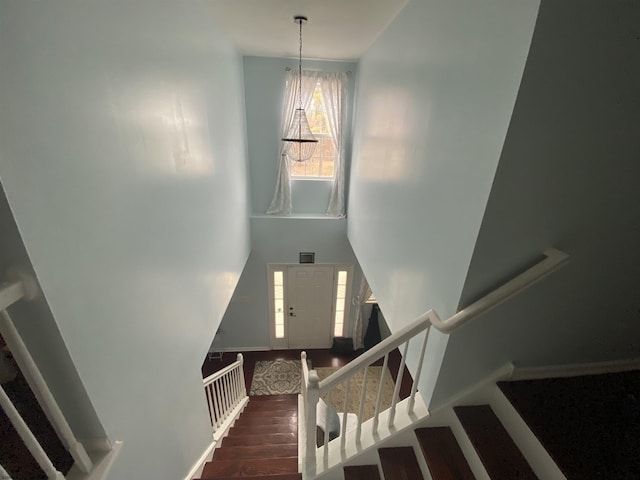 staircase featuring wood finished floors