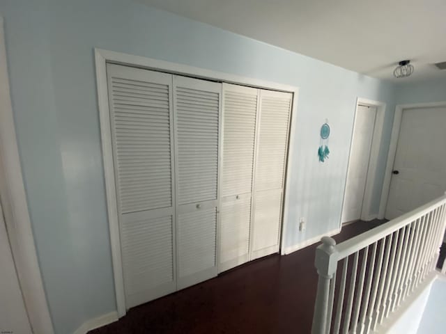 hallway featuring baseboards