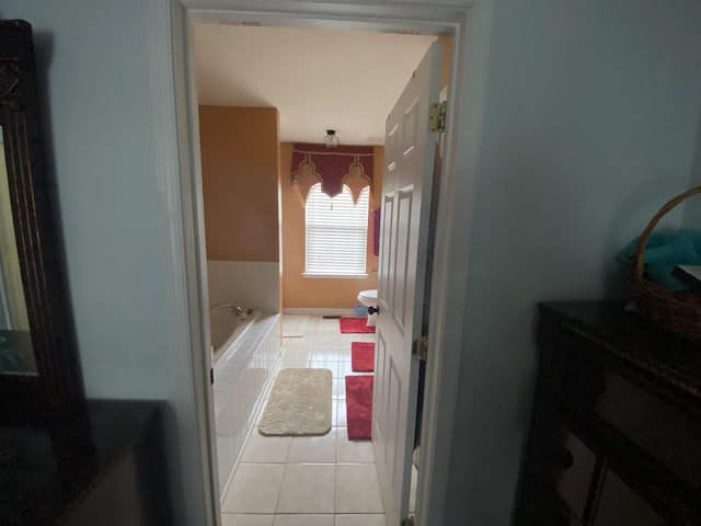 full bath with tile patterned flooring and a bath