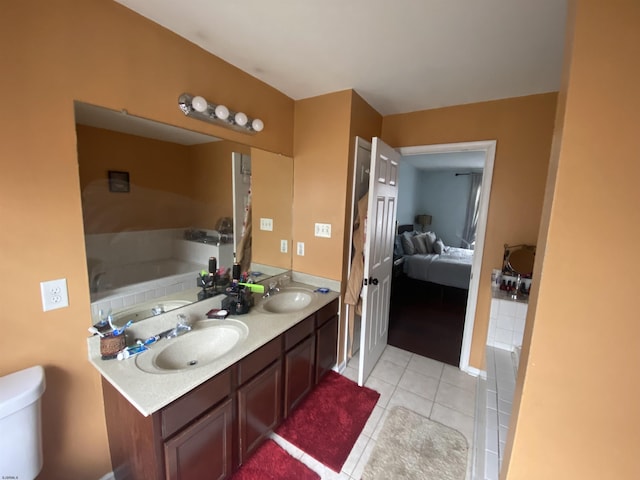 bathroom featuring double vanity, tile patterned flooring, connected bathroom, and a sink