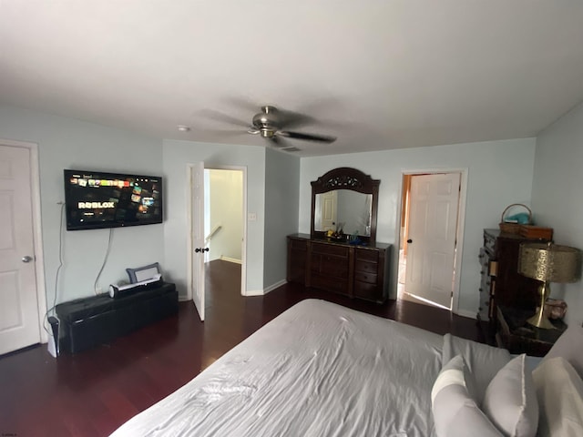 bedroom featuring dark wood finished floors, baseboards, and ceiling fan