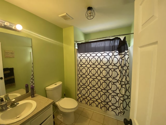 full bath with visible vents, a shower with shower curtain, toilet, tile patterned floors, and vanity