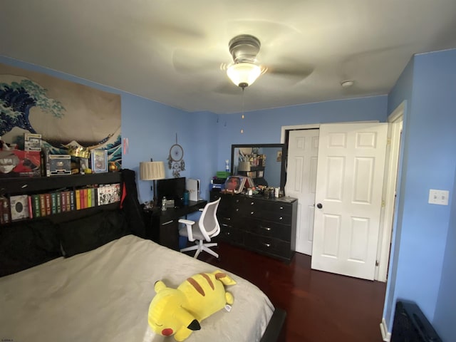 bedroom with ceiling fan and a closet