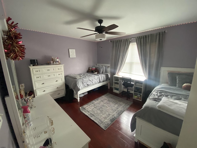 bedroom featuring ceiling fan and dark wood finished floors