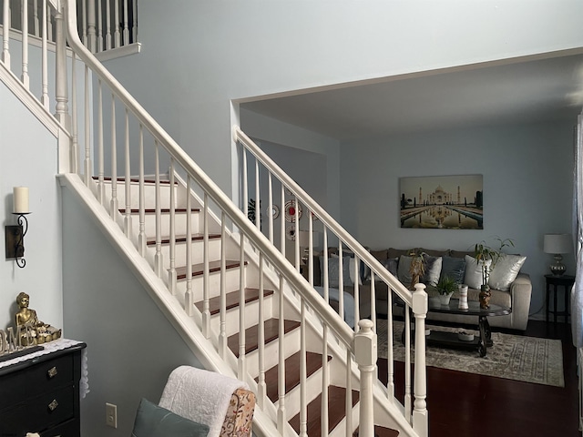 staircase with wood finished floors