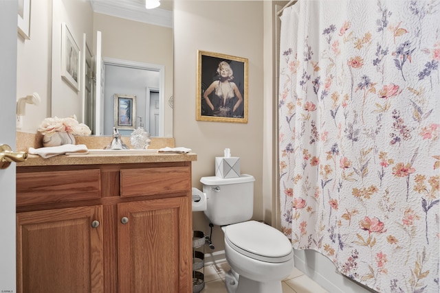 bathroom with tile patterned flooring, crown molding, vanity, and toilet