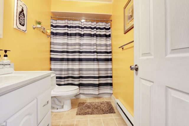 bathroom with toilet, vanity, baseboard heating, and tile patterned floors