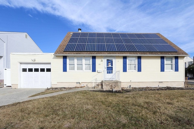 view of front facade featuring crawl space, an attached garage, roof mounted solar panels, and a front lawn