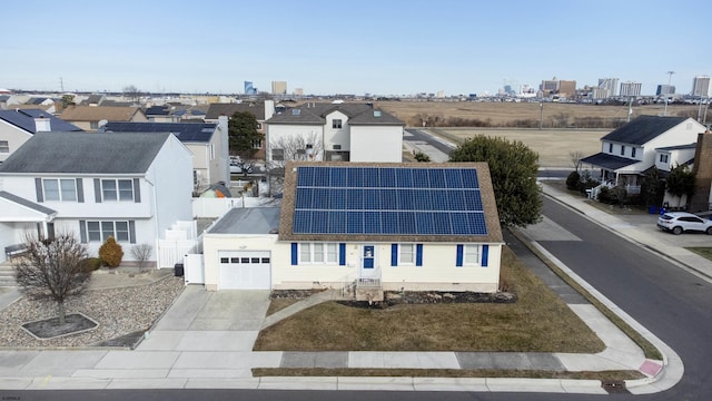 birds eye view of property with a residential view