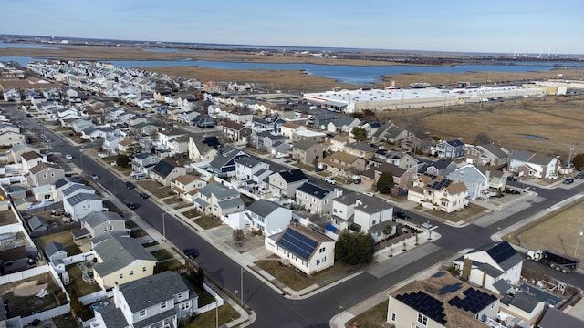 aerial view with a water view and a residential view