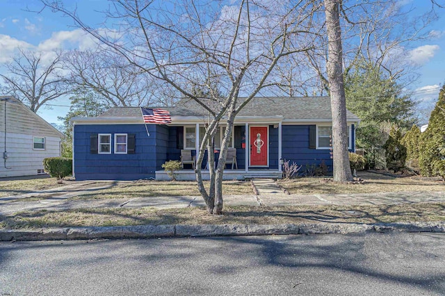 ranch-style house with roof with shingles