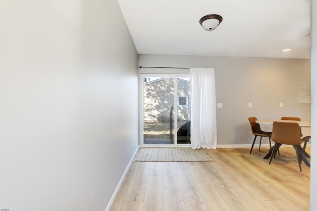 entryway with light wood-style floors and baseboards