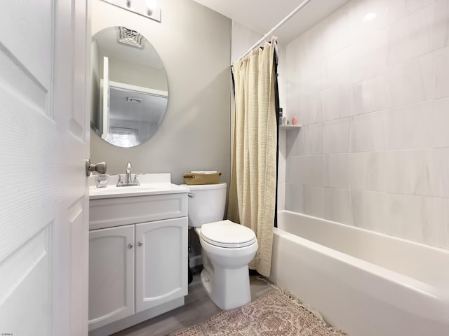 full bathroom with shower / bath combination with curtain, vanity, and toilet