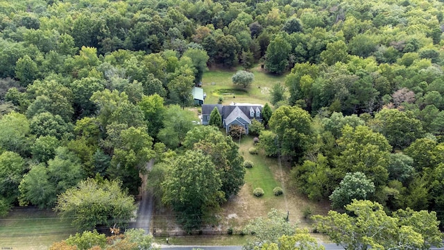 aerial view featuring a wooded view