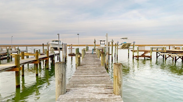 dock area featuring a water view and boat lift