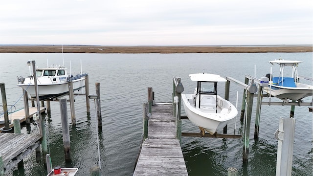 view of dock with a water view and boat lift