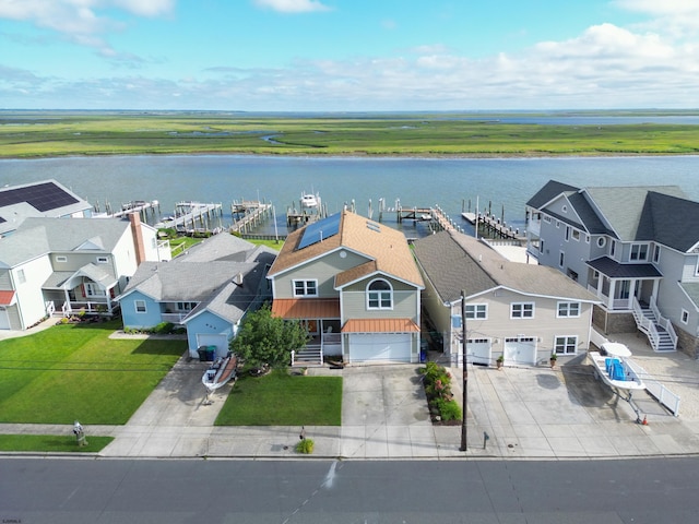 bird's eye view with a water view and a residential view