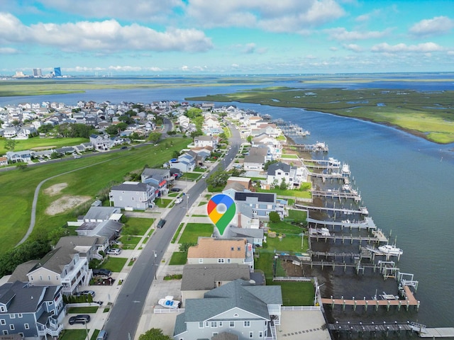 bird's eye view with a water view and a residential view