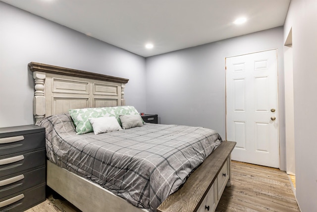 bedroom with recessed lighting and light wood-style floors