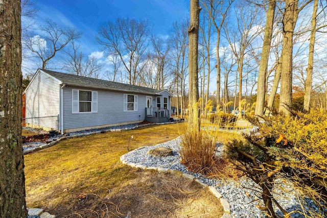 exterior space featuring a yard and fence