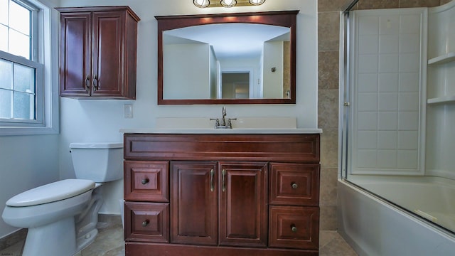 full bathroom with tile patterned flooring, combined bath / shower with glass door, vanity, and toilet