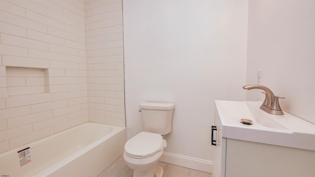 bathroom with bathtub / shower combination, vanity, toilet, and baseboards