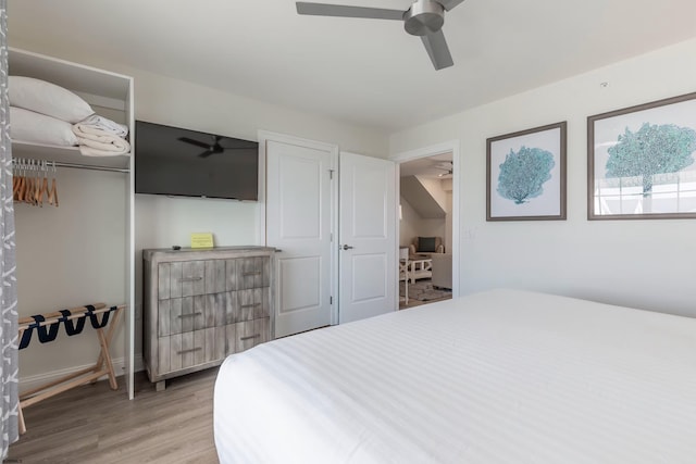 bedroom with ceiling fan and wood finished floors