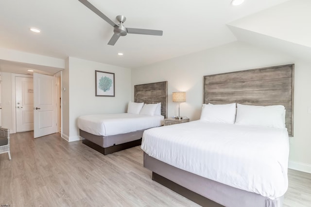 bedroom with light wood-type flooring, ceiling fan, baseboards, and recessed lighting