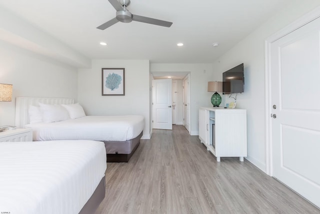 bedroom with a ceiling fan, recessed lighting, light wood-style flooring, and baseboards