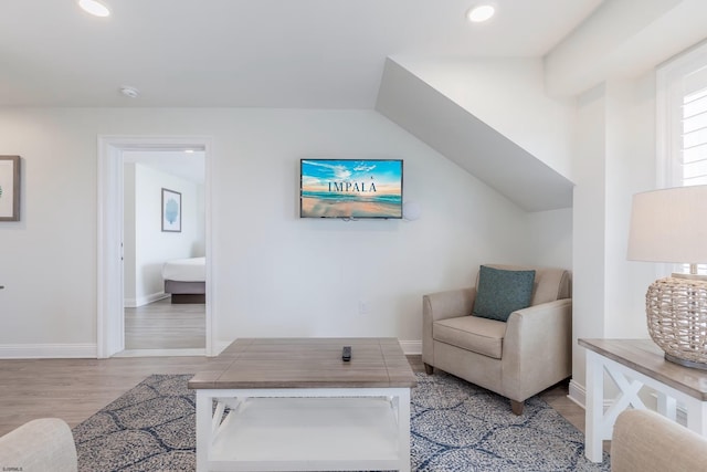 sitting room with light wood finished floors, baseboards, and recessed lighting